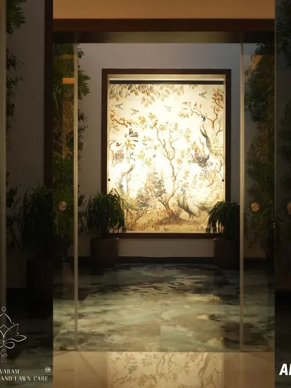 And this is the stunning result. The once-barren area is now an elegant corridor, featuring a beautifully illuminated art piece flanked by carefully selected plants, demonstrating our ability to create beauty from a blank canvas.