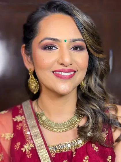 A happy smile from our lovely client Malhar. Her party makeup was designed to be long-lasting and photo-ready for a full day of wedding festivities.