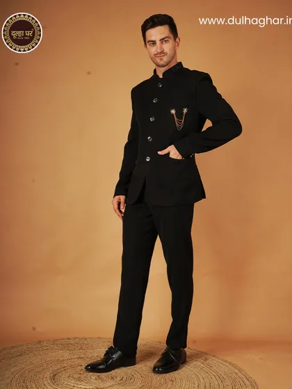 The timeless charm of a black Bandhgala suit. This classic ensemble is a staple for any formal wardrobe.