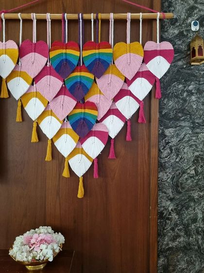 Transforming any space into a colorful wonderland with this stunning multicolored macrame leaf hanging. The love-filled hearts on this wall art are a reminder to celebrate the beauty of diversity.