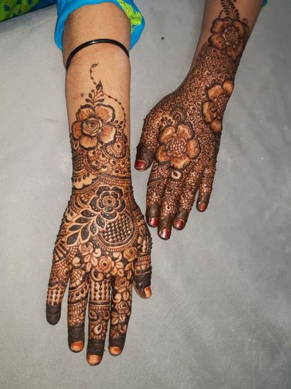 An Indian-inspired floral design, combining bold flowers with traditional filler patterns.