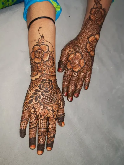 An Indian-inspired floral design, combining bold flowers with traditional filler patterns.