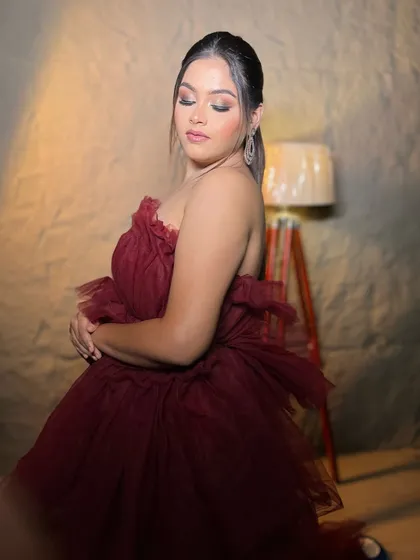 The elegance of this glam cocktail look is timeless. The soft lighting highlights the glowing skin and perfectly blended eye makeup.