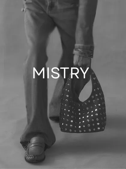For the days you want to carry edge with ease. This shot captures the feeling of my studded accessories in motion, blending a modern vintage aesthetic with a minimalist style.