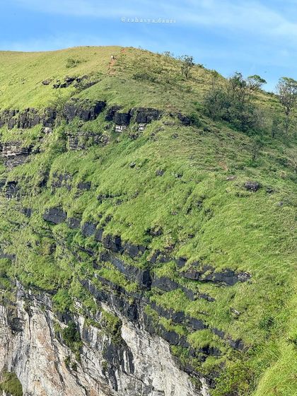 The dramatic cliffs and green slopes of the Bandaje trek.