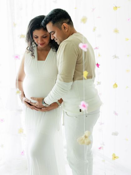 Standing together amidst a curtain of flowers, this portrait feels so dreamy and romantic. It’s a promise of the new beginnings that await them.