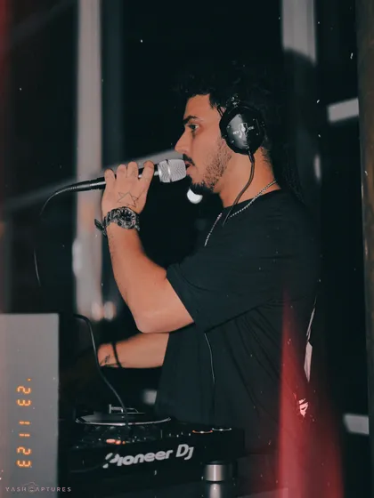 On the mic at Playboy, Gurgaon. I don't just play music; I interact with the crowd, hype them up, and make sure everyone feels like part of the show.