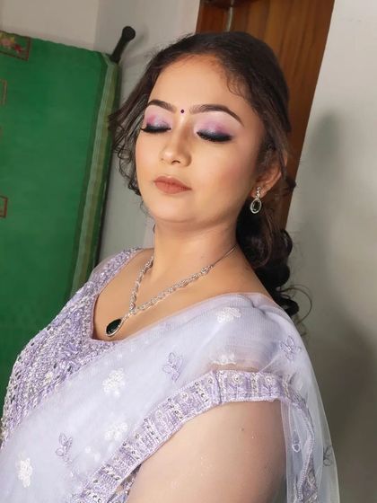 A close-up of the sangeet makeup, showing the beautifully blended lavender eyeshadow and flawless base.