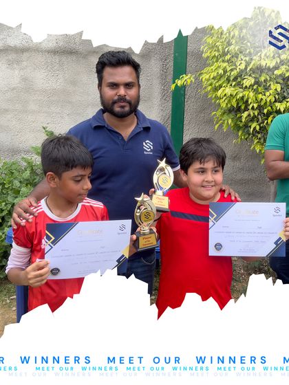 Two of our promising young footballers with their coach, showcasing their individual awards. We make sure to recognize personal growth and outstanding performance alongside team victories.