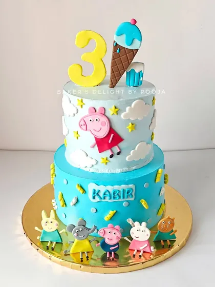 Another fun Peppa Pig cake, this time a two-tier design for a third birthday. This one features Peppa and her friends, with a special ice cream cone topper for the birthday boy.