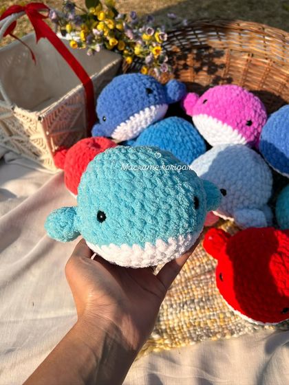 A handful of our mini crochet whales. Made with soft, chunky yarn, they are available in a sea of colors and are perfect as small gifts or party favors.