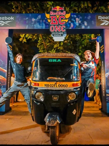 The story of an event includes the fun, candid moments. This shot with the auto-rickshaw adds a uniquely Mumbai flavor to the Red Bull event, making it feel authentic and grounded in the city's culture.