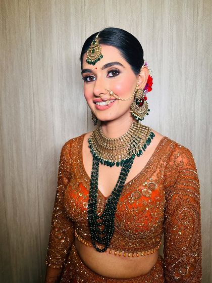 A stunning look for a wedding guest or bridesmaid. The bride's sister is glowing in this traditional attire with makeup that is both classic and radiant.