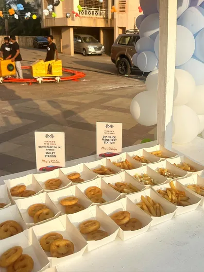 Another view of the popular Smiley and French Fry station, with a toy train in the background adding to the fun, kid-friendly atmosphere of the event.