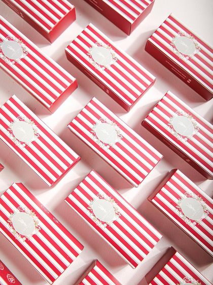 Our signature red and white striped ice cream bar boxes, a cheerful and stylish way to gift a frozen treat.
