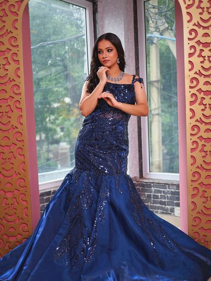 A full-length pose that highlights the gown's flattering silhouette.