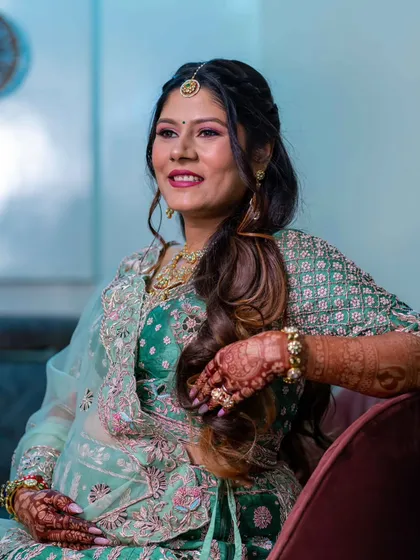 A candid moment of joy. Her radiant smile and glowing makeup perfectly capture the happiness of this special milestone.