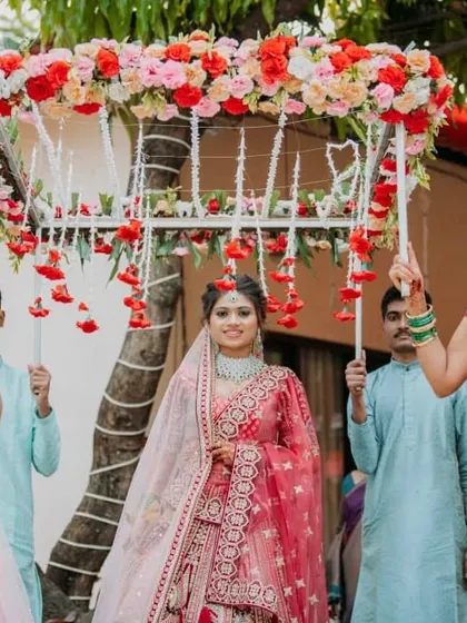 A classic and elegant bridal entry. The bride walks in under a beautiful 'phoolon ki chaadar' held by her loved ones, a timeless tradition I love to incorporate into weddings.
