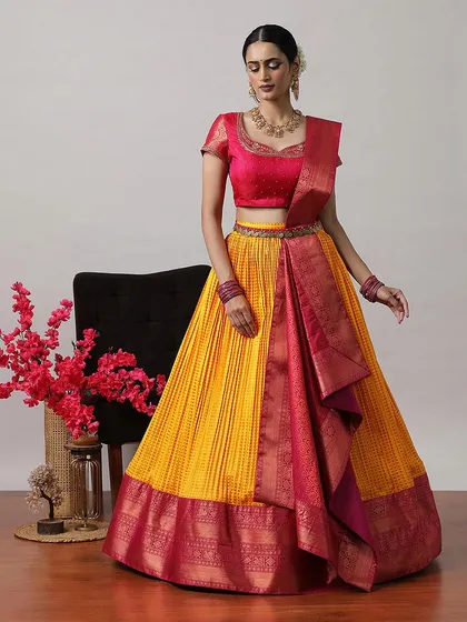 A vibrant yellow and pink half-saree lehenga, perfect for a Haldi ceremony or other daytime festivities.