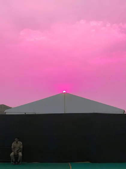 A final, vibrant edit of the sunset scene, with the sky rendered in a shocking, solid pink.