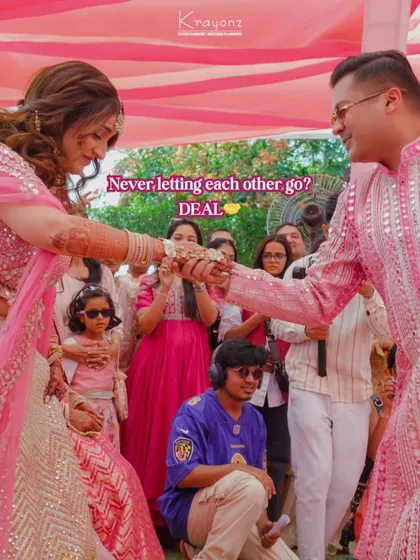 "Never letting each other go? DEAL." A sweet, candid moment between the couple during their Haldi, sealing their promise with a playful gesture.