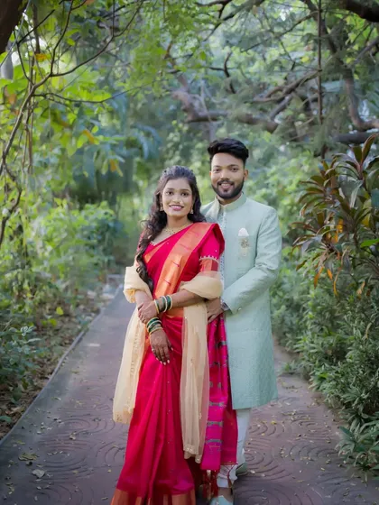 A classic portrait of the engaged couple amidst lush greenery. We ensure both traditional poses and candid moments are part of your engagement album.