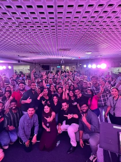 A fantastic group photo with the audience after a corporate gig. Their energy was amazing.
