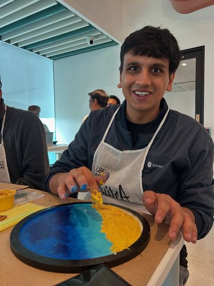 A participant from Samsara tech adding the finishing touches to his resin beach art. Our workshops are hands-on from start to finish.