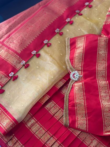 Detail of the sleeve pendant, showcasing the intricate stone and zardosi work.