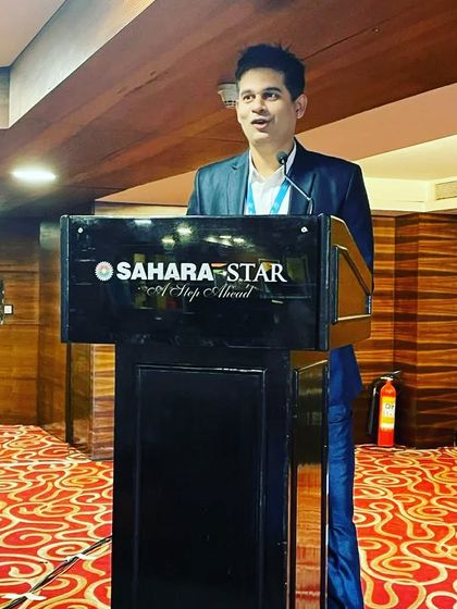 At the podium at the Sahara Star hotel for a corporate conference. Hosting in prestigious venues like this is always a pleasure.