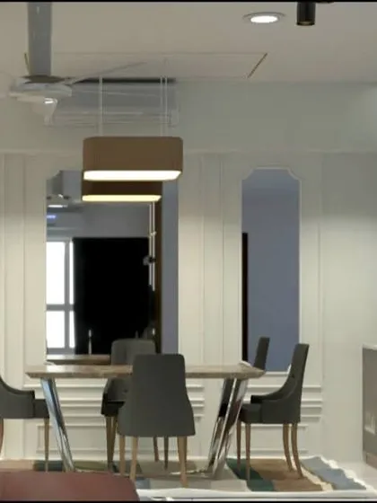 The dining area is elegantly framed by architectural molding on the walls. This design choice adds a layer of sophistication and visually separates the dining space from the living area.