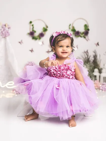A little princess twirling in her purple dress. This first birthday shoot was full of magical moments and happy smiles.