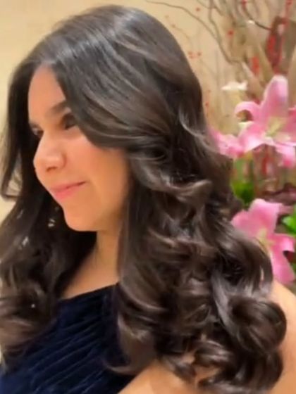 Another angle of this beautiful hairstyle, showcasing the healthy shine and perfect formation of the curls.