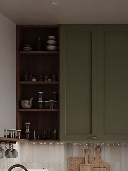 This is a masterpiece of sophistication. The olive green shaker cabinets are paired with open wood shelving and a tiled backsplash, creating a look that is both classic and contemporary.