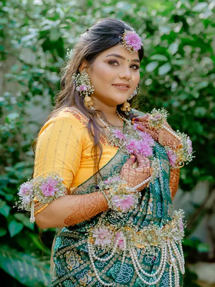 A classic portrait of the mother-to-be during her baby shower, looking radiant in her traditional attire.