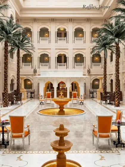 The stunning indoor courtyard of Raffles, Jaipur, with its towering palms and fountains. This is a breathtaking space for a welcome dinner or an elegant Sangeet.