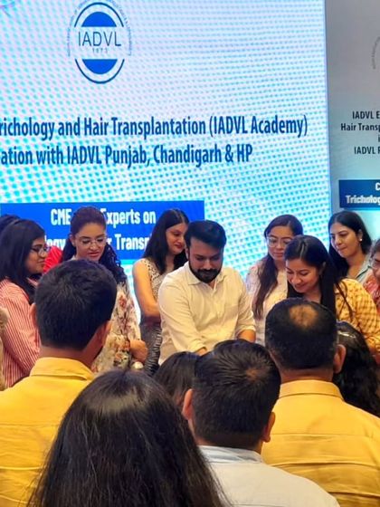 Demonstrating techniques to an enthusiastic group of delegates during the trichology workshop.