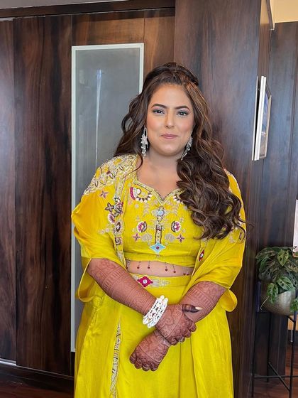 A front view of the cocktail party hairstyle. The soft waves frame the face beautifully, creating a flattering and glamorous look.