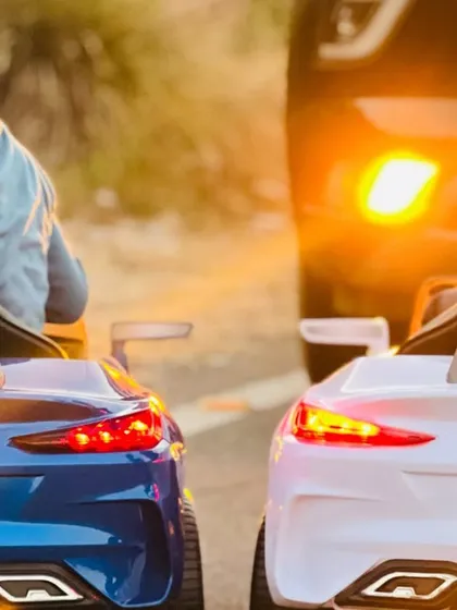 A cool shot of the back of the ride-on BMW cars, showing the realistic details like working tail lights.