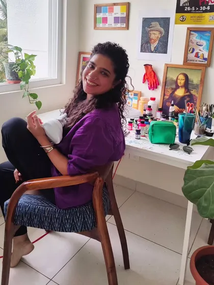 A quick look up from my work desk. As a self-taught artist, my studio is filled with inspiration, from Van Gogh prints to my collection of acrylic leather paints, all essential parts of my creative process.