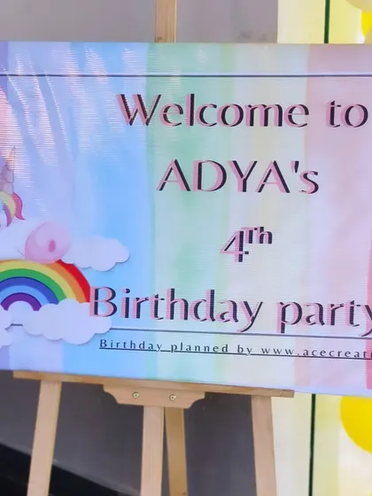 A sweet and simple unicorn and rainbow-themed welcome sign for Adya's 4th birthday party.