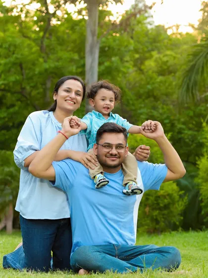 A classic family pose, perfect for an outdoor setting. Having the little one on dad's shoulders always results in big smiles and a fun, relaxed portrait.