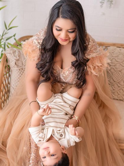 A playful, upside-down moment between a mother and her baby boy. These fun interactions result in the most joyful and memorable photos.