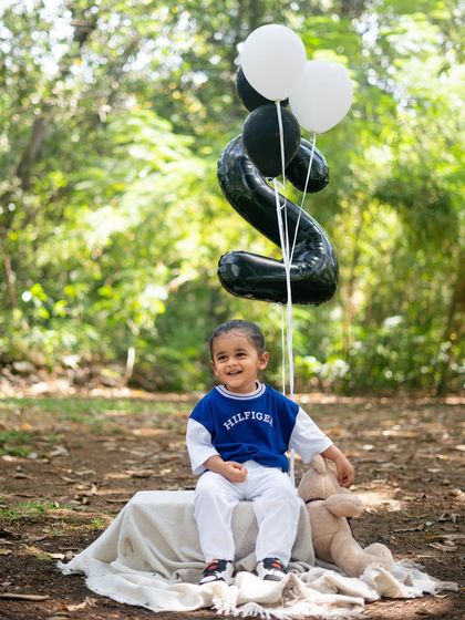 A happy smile with his teddy bear and birthday balloon. Even the coolest bikers have a soft side.