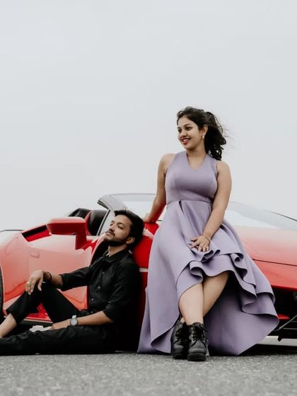 A candid and happy moment with the Lamborghini, showing the fun and excitement of the destination shoot.