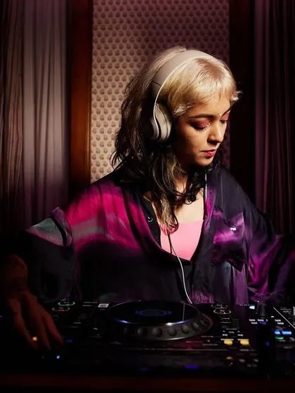 Me in my zone, focused on the mix. This is my happy place, blending tracks and finding the perfect groove on the Pioneer DJ console.