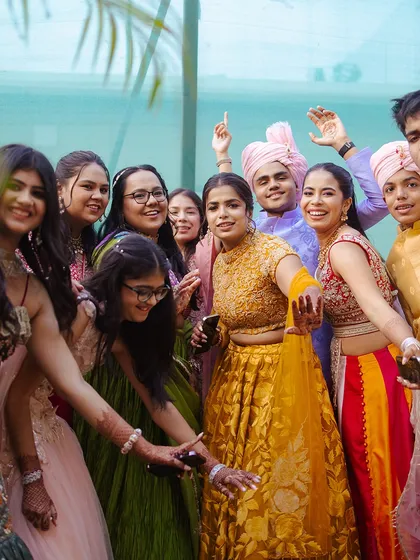 The joy of a Baraat is in the shared celebration. Here, friends and family of the groom take over the streets, dancing with pure energy and happiness.