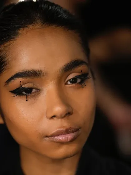 We love creating unique looks for designers like Stoique Studio. This graphic, dotted eyeliner was a standout moment from Lakme Fashion Week.