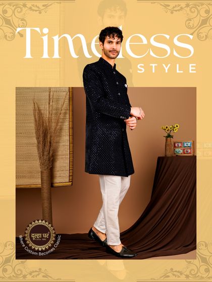 Timeless style, forever royal. A black textured sherwani paired with white trousers creates a classic, high-contrast look that is always in fashion.