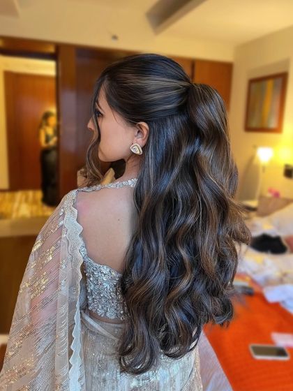 A side view of the half updo, showing how the hair is elegantly pulled back. This is a great style for keeping hair out of the face while still looking glamorous.